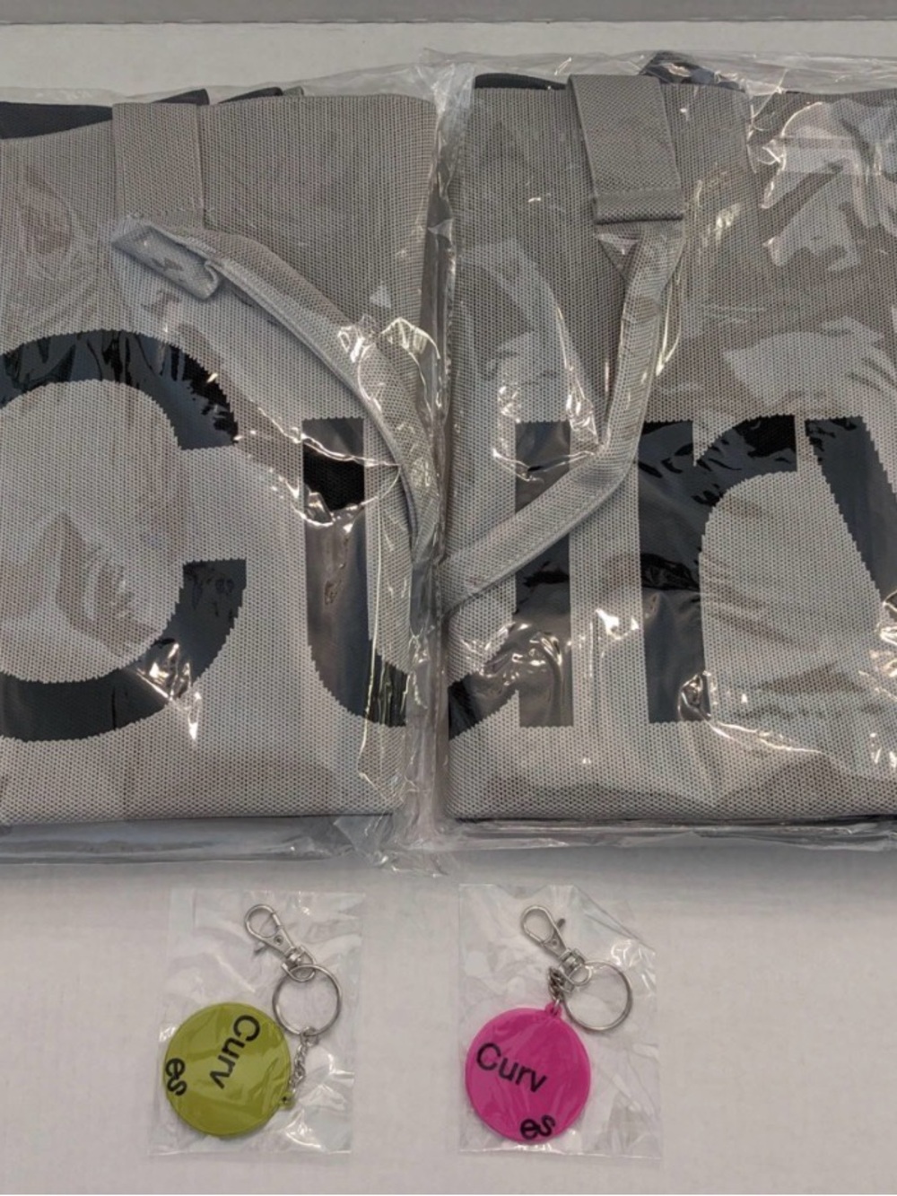 Curv Branded Gray Phone Tote Cover with Pink & Green Keychain